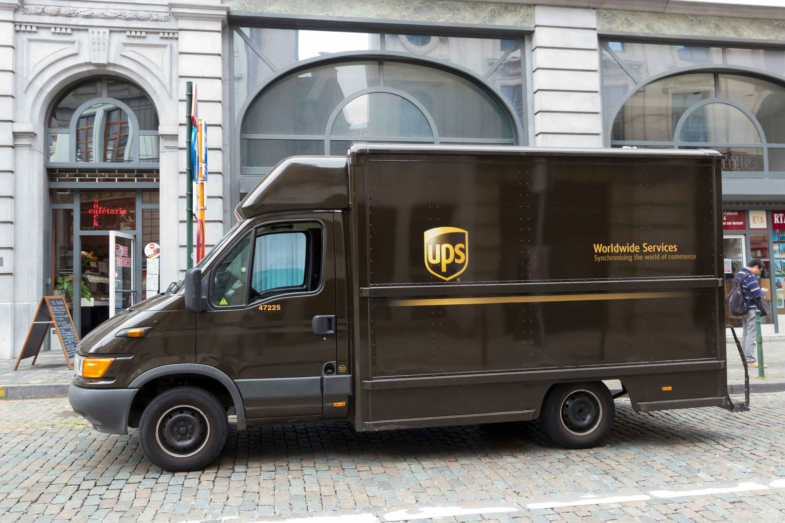 A parked UPS truck in front of a store